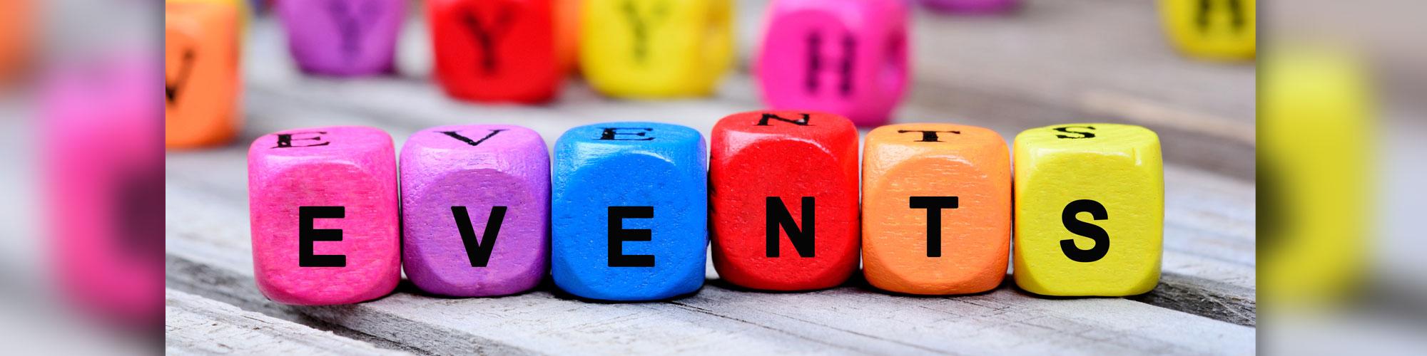 colorful blocks with black letters that spell out events