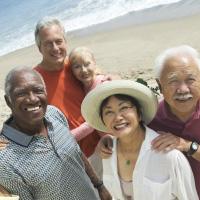 diverse group of seniors on the beach